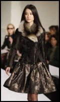 Oscar de la Renta brocade skirt and biker jacket.