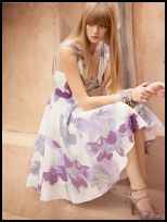 Oasis Spring Summer 2008 Campaign - white dress with full skirt and lilac print pattern.