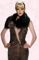 Catwalk fashion design with rose corsage and from fashion house Venexiana.