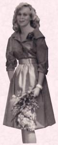 Gaynor wearing a shirt waist dress c1960.