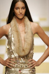 Hobeika gave gold lace a modern turn in a bell-shaped dress with geometric-cut sheared-mink fur trim