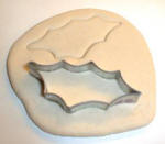 Cut some holly leaves using a holly leaf cutter.