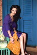 Designers at Debenhams purple puff sleeve dress �45/�70 from the range called Jeans by Jasper Conran. J Jeans by Jasper Conran cork buckle platforms �40/�62; Red Herring slouch bag �25/�38; Mood bracelets �4/�7.  