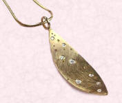 Gold and diamond pendant from love2have.co.uk.