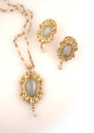 Moonstone earrings with matching pendant are by Kiran Nirankari