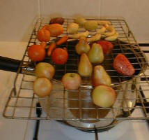 Setting the Food Powders on Marzipan Fruits with Steaming Saucepan 