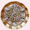 Plate of mince pies dusted with icing powder.