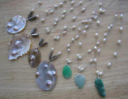 Mother of pearl pendant and jade carved pendants with pearl wires