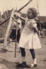 Costume history and fashion history 1950s - girl playing in yard.