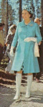 The Queen wearing a much shorter more modern 1960's coat and boots.