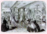 Picture of a shop where Victorian cashmere shawls are displayed and sold. Fashion history.