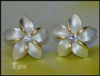 Simply Jewelry - The Hawaiian Plumeria (frangipani) stud earrings have a frosted finish to the silver and feature 14k gold plate highlights around a clear cubic zirconia.