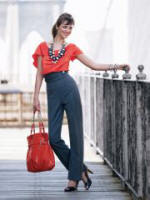 Orange silk top �39/�59, grey high waisted silver square military button trousers �39/�59 euros, necklace from a selection at Principles