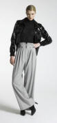  New Look Autumn/Winter 07/08 Collection - Womenswear Collection - Patent bomber £40/58€, Grey high waisted trousers £28/40, Black polo neck £20/29€, Black socks £2.50/3.50€, Black shoes £25/36€.