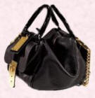 This Dolce &Gabbana handbag proudly displays a golden nameplate.