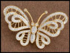 Heavenly treasures - The fine jewellery butterfly brooch pin left has a different effect when diamonds are set against yellow gold