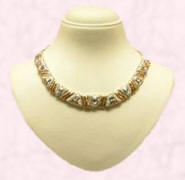 White and yellow metal necklace on display in Hong Kong in 2007.