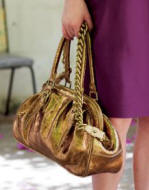 This gold bag is from The House Fraser and their new range called Untold.