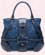 Blue suede and perforated leather butterfly bag is by Alexander McQueen. This bag is available from Browns Fashion of South Molton Street, London, UK or their online site at �1015