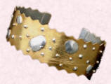 A Saretta cuff design in gold and silver