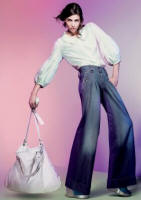 Oasis pleat front jeans �50, white oversized slouchy bag�30, silk balloon sleeve blouse �45. 