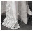 1922 Wedding Dress. Evelyn's train is crunchy with texture. Just look at those raised floral forms that decorate the edge of the train. Her shoes are a Mary Jane variation.