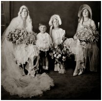 Fashion history bridal group - bridesmaid flower girl, page boy and matron of honour bridesmais wearong hat. C1928 to 1929.