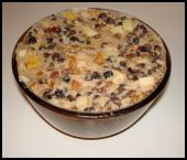 Christmas pudding mix in a overfilled basin. Fill to within half an inch of the rim of the basin.