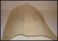 Cover the basin top with a pleated sheet of greaseproof paper, then a pleated piece. This allows for any rising of the pudding.