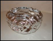 A well sealed pudding basin ready for boiling in a saucepan or for oven steaming
