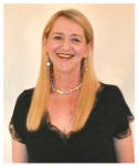 5 - Pauline Thomas in 18" clip in human hair extensions after trimming and styling behind ears.