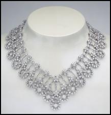 The Van Cleef & Arpels diamond Organdi Couture collection necklace left is made of white gold and diamonds (79.18 carats) and the piece makes an outstanding item of jewellery.
